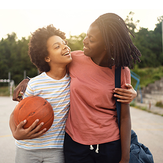 Mother and Child Playing Basketball Together.