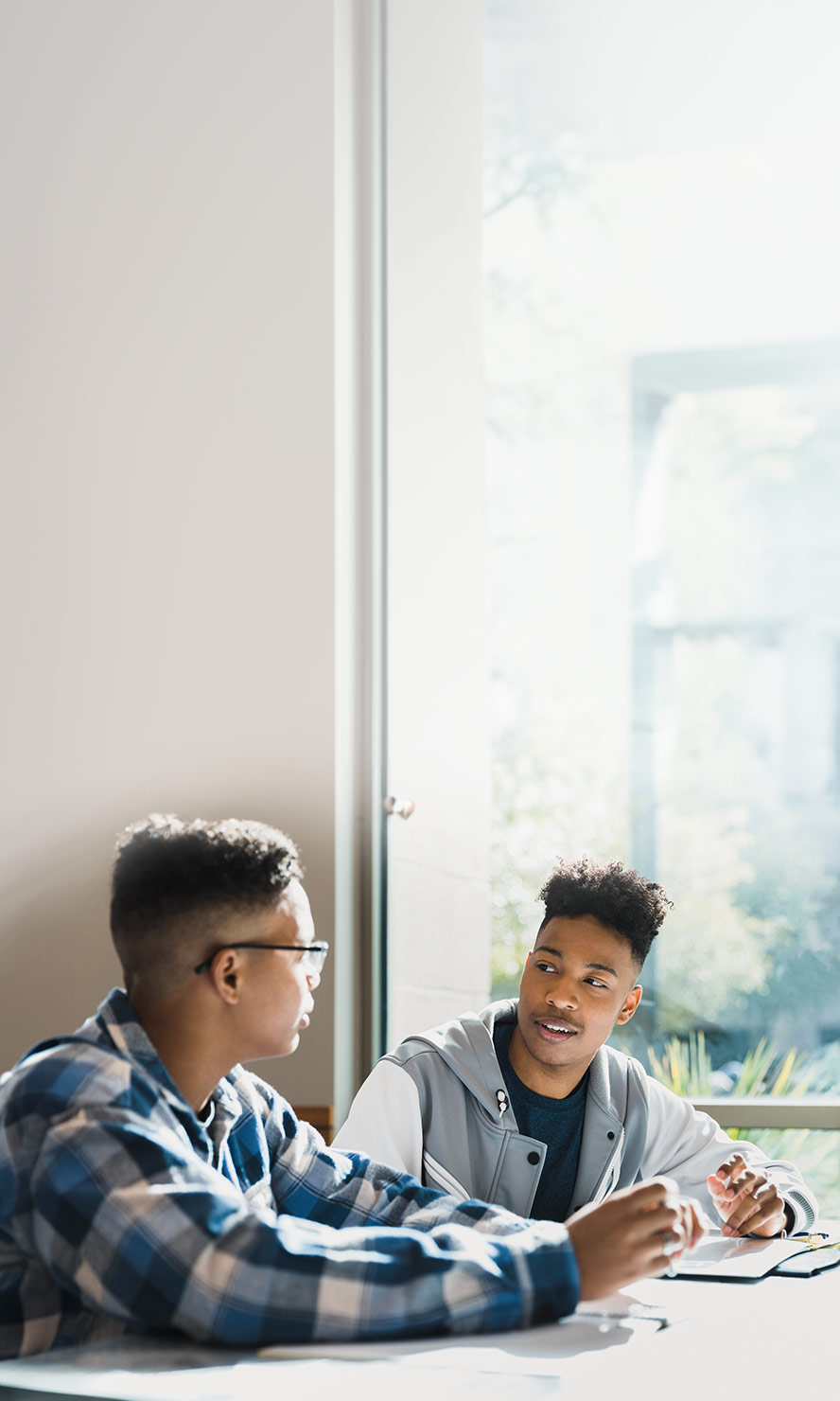 two male teens talking