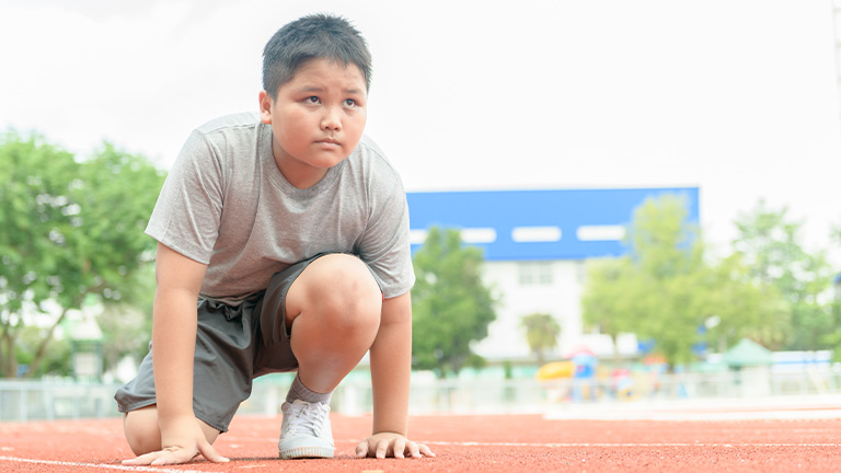 Boy at the starting line ready to begin race. 